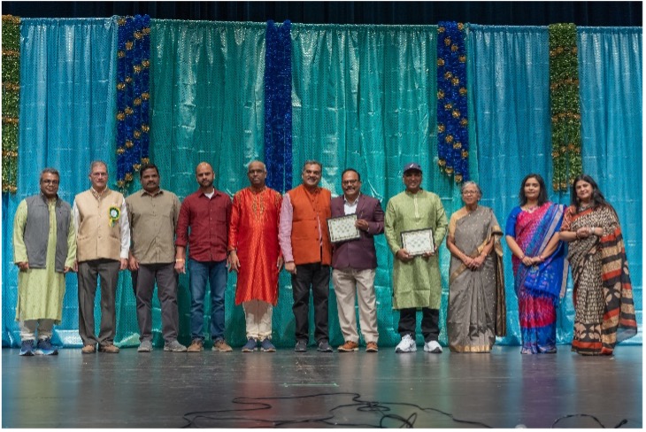 A group of people standing on a stage