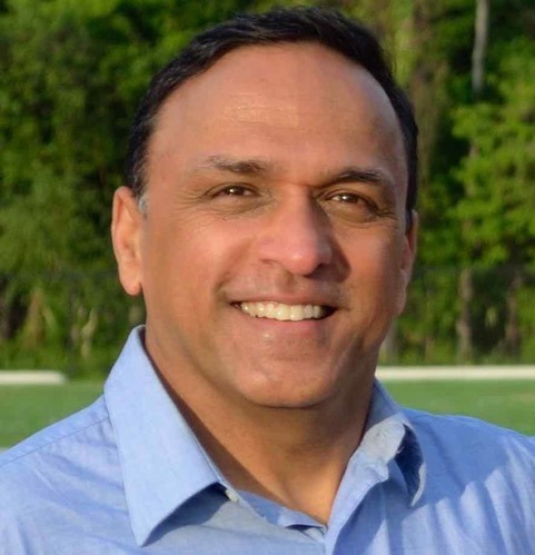 A person in a blue shirt    AI-generated content may be incorrect.